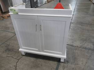 lot 215 image: 2-Door Vanity Cabinet in White with Chrome Pulls, Measures Approximately 29 X 15 X 31 14 Tall