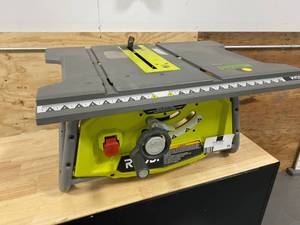 lot 34 image: RYOBI 15 Amp 10 in. Table Saw with Folding Stand