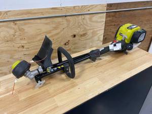 lot 38 image: RYOBI 4-Cycle 30cc Attachment Capable Straight Shaft Gas Trimmer