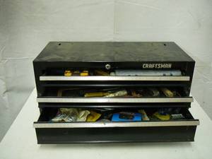 lot 55 image: Craftsman Tool Box and Tools Bits , Hex Bits, Screw Driver, Hack saw, Nut Driver, Flashlight, Clamp, Nails, Screws, Wall Board Hooks