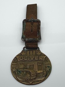 lot 7 image: Oliver Tractor Watch Fob