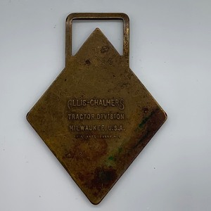 lot 16 image: Vintage Watch Fob- Allis Chalmers Tractors Road Machinery