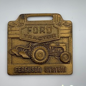 lot 11 image: Vintage Watch Fob- Ford Tractor Ferguson System