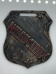 lot 18 image: Wilcox Trux Motor Car Manufacturers Watch Fob