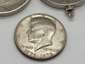 lot 105 image: 1971 and 1972 Eisenhower Dollar Coins Made into Pendants & 1976 Bicentennial Kennedy Half Dollar Coin