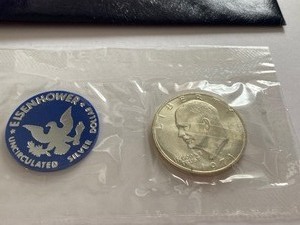 lot 139 image: Blue Ike - 1971 Eisenhower Uncirculated Silver Dollar