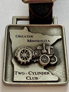 lot 45 image: John Deer Model GP Tractor Greater Minnesota Two-Cylinder Club Pewter Watch Fob