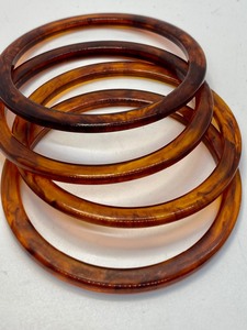 lot 145 image: (5) Vintage Lucite Tortoise Shell Bangles