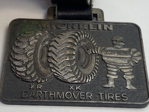 lot 169 image: Vintage Michelin Earthmover Tires Watch Fob