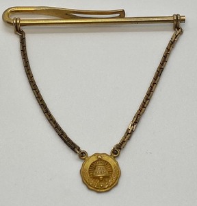 lot 206 image: Vintage 110 10k Gold Charm Bell System Service Tie Clip