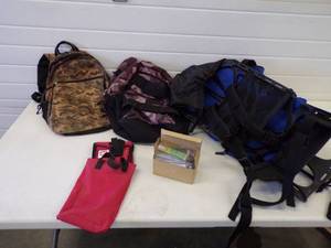 lot 49 image: Camping Backpacks, Pocket Chair and tent repair