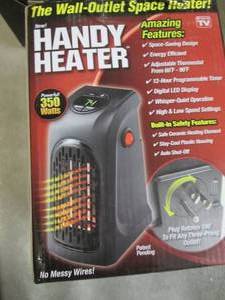 lot 210 image: 350-Watt Wall Outlet Handy Heater o...