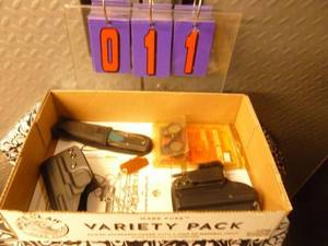 Flat of misc holsters & gun parts. As shown.