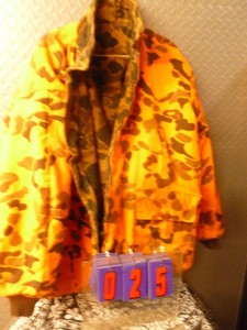 Orange hunting jacket. Size large. As shown.