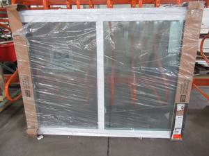 lot 602 image: American Craftsman 70 Series 5040 White Vinyl Sliding Window, Approximately 60 X 47 X 1 34 With Screen - Fixed Panel one Pane is Broken.