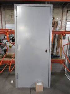 lot 605 image: Armor Door Approximately 36 x 82 x 6 (32 x 79 Slab) Fire-Rated Gray RH Swing Flush Unfinished Steel Commercial Door Slab with Knock Down Frame and Hardware.
