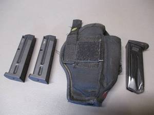 lot 134 image: Holster and Magazines
