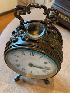 lot 3 image: Small Oval Beveled Glass Unusual Clock