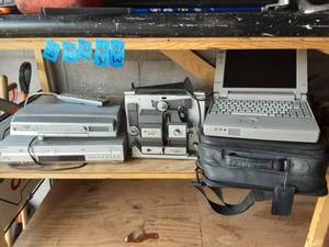 lot 19 image: Sony VHSDVD Player, Sony Under Cabinet Stereo, Bell & Howell Super & 8 MM Progecter & Toshiba Lap Top Computer With Accessories.r