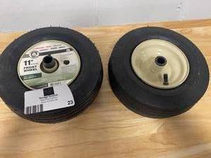 lot 23 image: Lot Of 2 MTD GENUINE FACTORY PARTS 11 in. x 4 in. Pneumatic Zero Turn Front Wheel Assembly with Ribbed Tread