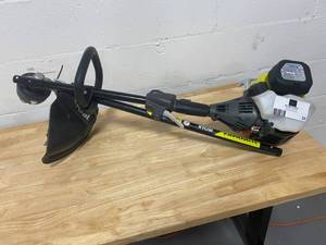 lot 53 image: RYOBI 4-Cycle 30cc Attachment Capable Straight Shaft Gas Trimmer