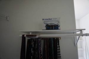 lot 101 image: Large Lot of Mens Neck Ties With Tie Tracker Electric Rack