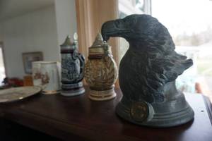 lot 86 image: Lot of Avon Brand Numbered SteinsMugs With NRA Commemorative Eagle Figurine