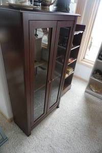 lot 34 image: Dark Wood Finished 2 Door Glass StorageDisplay Shelving