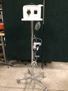 lot 31 image: DESIGNS FOR VISION Quadrilite 4000 Light Source WITH HEADLIGHT GEAR ON MOBILE STAND - GREAT WORKING CONDITION