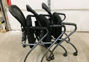 lot 40 image: MSRP $200 EACH&nbspTitanium Finish Visitors Chair -Heavy Thick Padded Seat, Arm Rests, Casters and Breathable Mesh ProGrid Back - These Are Folding, StackingNesting, Mobile Chairs - Great For Office Or Home Entertaining - Lot of 3 - Great Condition