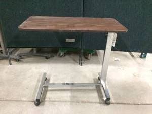 lot 52 image: WOOD GRAIN OVERBED TABLE