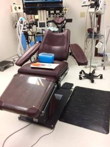 lot 21 image: Dexta MK20X3604-14&nbspDental Oral Surgical Exam Chair with Footswitch - Working Condition - Arms Have Wear Underneath