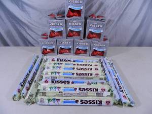 lot 213 image: 8 New Large Hershey Kisses and 15 Packages of Regular Hershey Kisses
