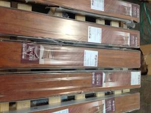lot 9 image: LOT WHIT  6 CASES OF Home Decorators Collection High Gloss Jatoba 8 mm Thick x 5-58 in. Wide x 47-34 in. Length Laminate Flooring (18.65 sq. ft.  case)