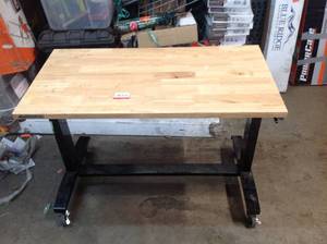 lot 34 image: Husky 46 in. Adjustable Height Work Table ( missing handle ) in used condition