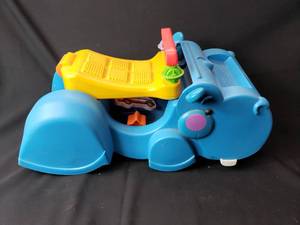 lot 2 image: Older Plastic Ride On and Walker Hippo