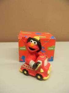 lot 46 image: SESAME STREET ELMO ON FIRETRUCK SALT & PEPPER SHAKER - NEW IN BOX - SEE PICTURES