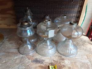 lot 33 image: 6-Clear Glass Oil Lamps