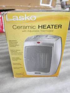 lot 25 image: Lasko 9.2 in. 1500-Watt Electric Po...