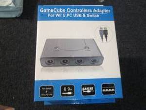 lot 114 image: 5 GameCube Controllers Adapters...
