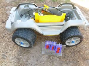 Power Wheels chassis for parts. As shown.