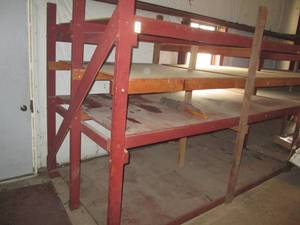 6 deep, 20 foot long approximately wood rack.  BUYER responsible for disassembly and removal