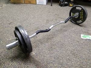 lot 296 image: Weight Lifting Curling Bar with 70lbs. Metal Weights