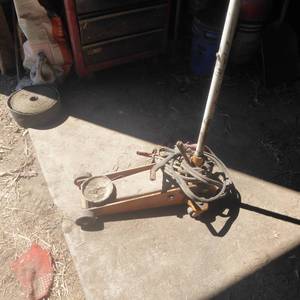 lot 39 image: Floor Jack with Jumper Cables
