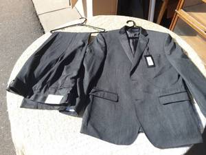 lot 56 image: NEW With Tags 2-Piece Mens Suit.  Andrew Marc N.Y. 42 Reg. 35 W  Marked $595.00