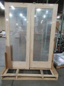 lot 600 image: Steves & Sons Universal 1-Lite Clear Glass Unfinished Pine Double Prehung Interior French Door with Nickel Hinges. Approximately 61 58 x 81 34 x 4 916 Wall.