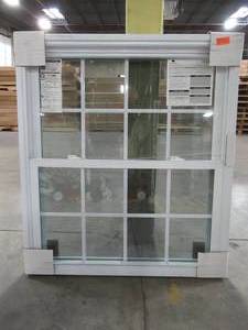 lot 601 image: American Craftsman Approximately 40 14 x 45 34 x 3 14, White Vinyl Double Hung Window WIth Full Screen, Internal Grills