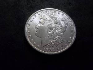 lot 5 image: 1884 O Morgan Silver Dollar