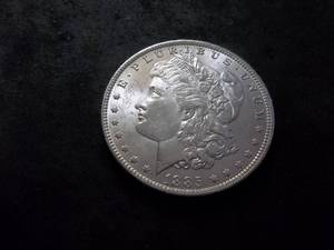 lot 6 image: 1885 O Morgan Silver Dollar