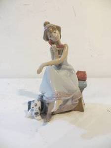 lot 28 image: Lladro Girl on Telephone with Dog (Chit-Chat Girl) Figurine